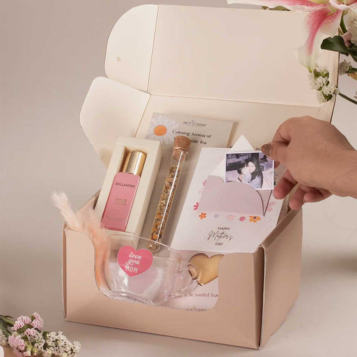 Photo Personalized Celebrating Mom’s Love Gift Hamper | Includes 1 Perfume, 4 Heart-Shaped Baked Cookies, 1 “Love You Mom” Glass Tea Cup, 1 Mother’s Day Card, 1 Chamomile Tea Glass Tube, 1 All Things Nice Gift Box