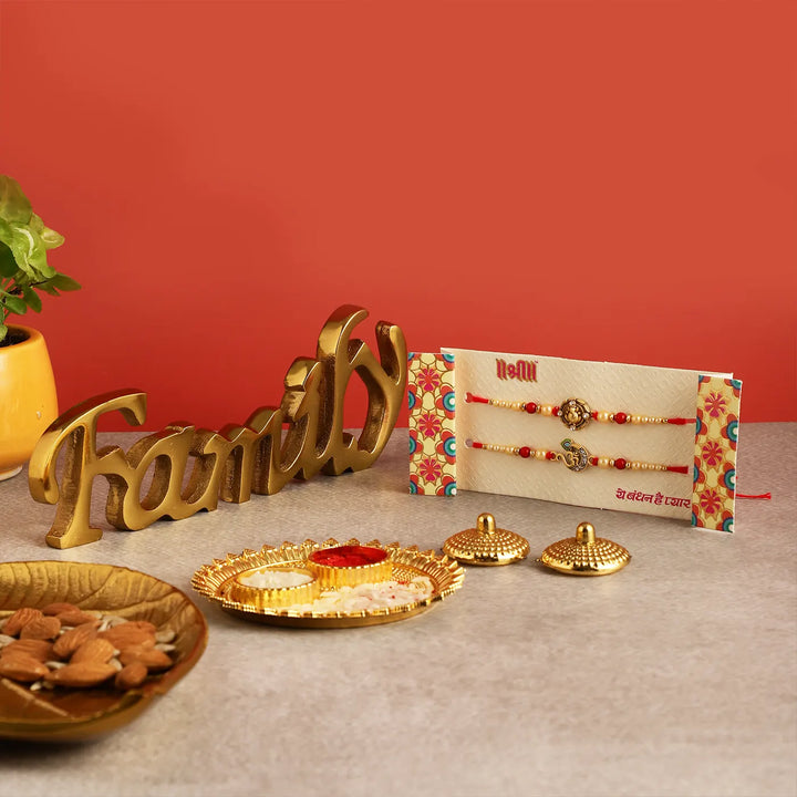 Handmade Festive Rakhi Hamper | Includes 1 "Family" Table Decor, 1 Ganesha Rakhi, 1 Om Rakhi, 1 Roli Chawal