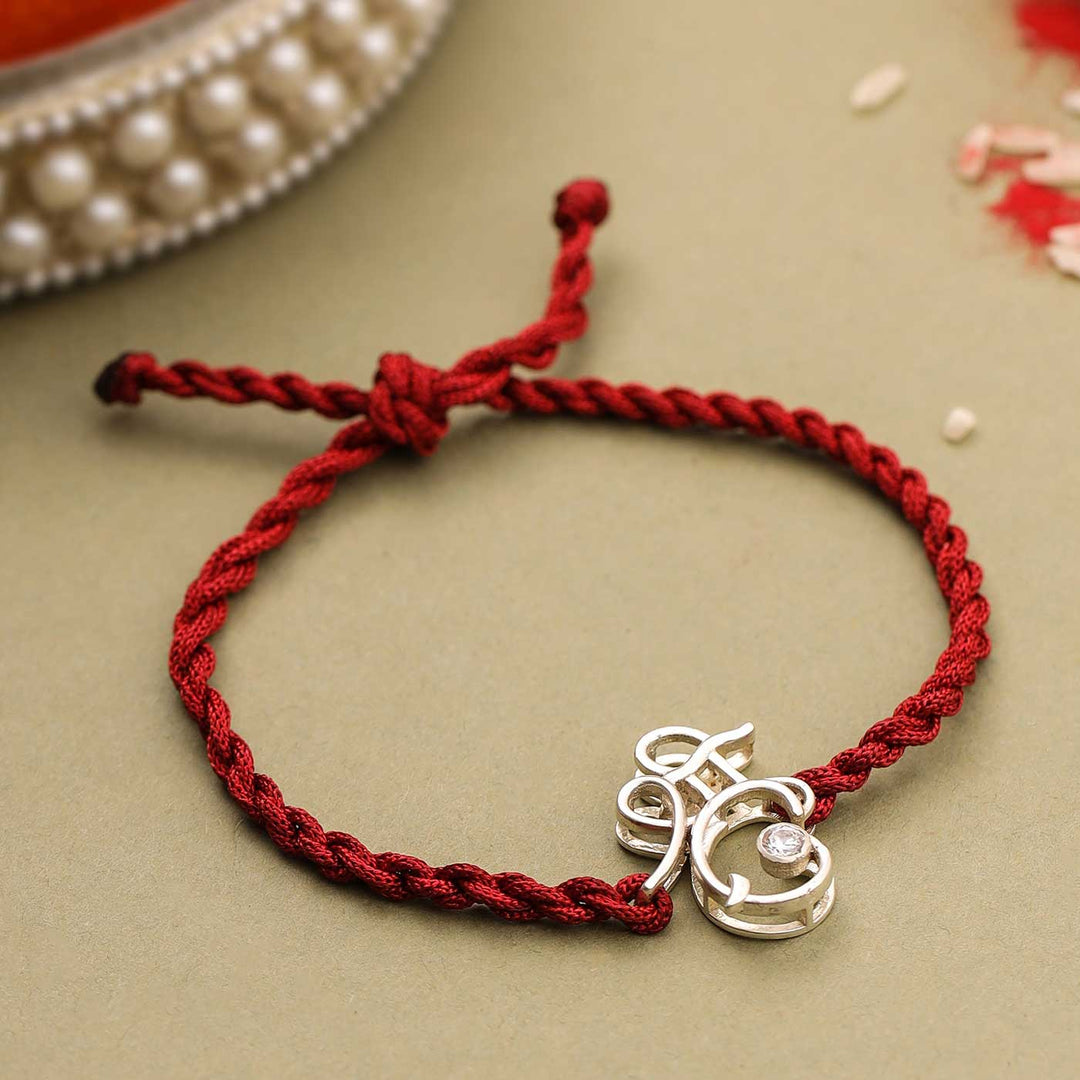 Handmade Shri Design Religious Silver Rakhi For Brother - Close-up of Rakhi Detail