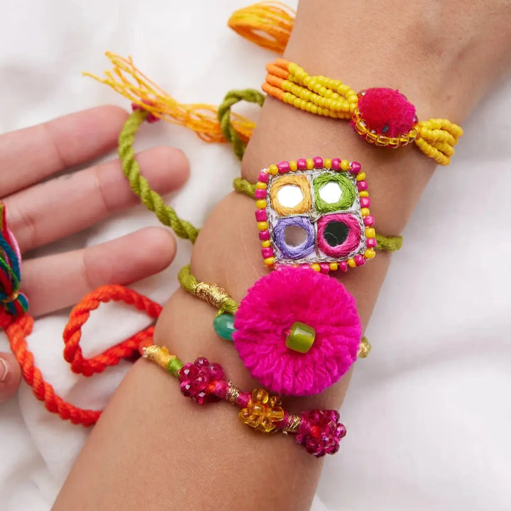 4 pc Rakhi + Brass Thali Set | Premium Erika Pom Pom Rakhi Set with Roli Chawal