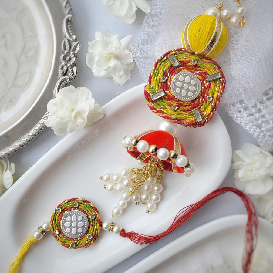 Handmade Beaded Lotus Design Silver Rakhi Hamper With Roli Chawal For Bhaiya And Bhabhi - Pair Display on Plate