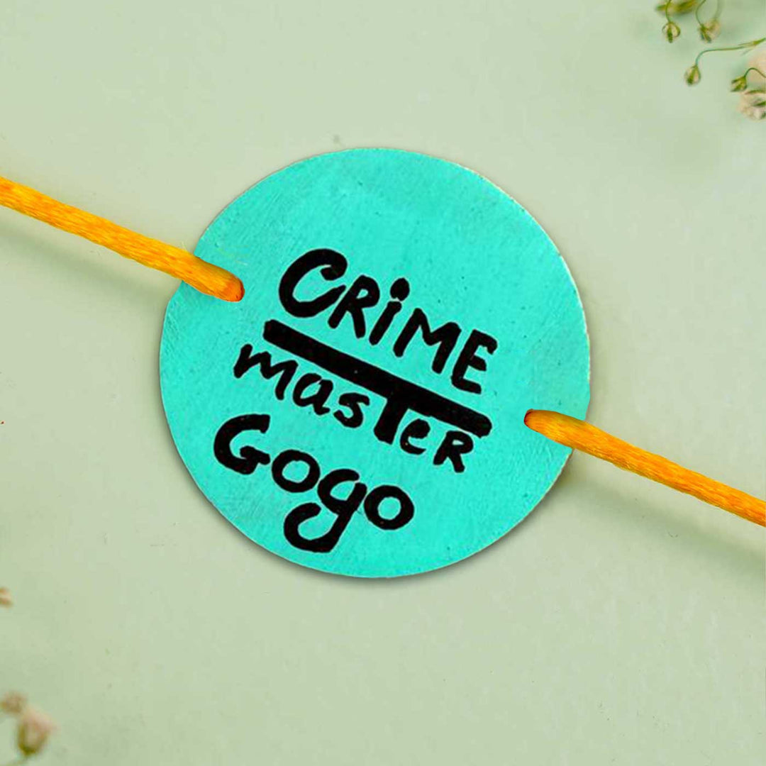 Personalized Hand Painted Crime Master Gogo Wooden Rakhi With Roli Chawal - Close-up of Round Tag with String
