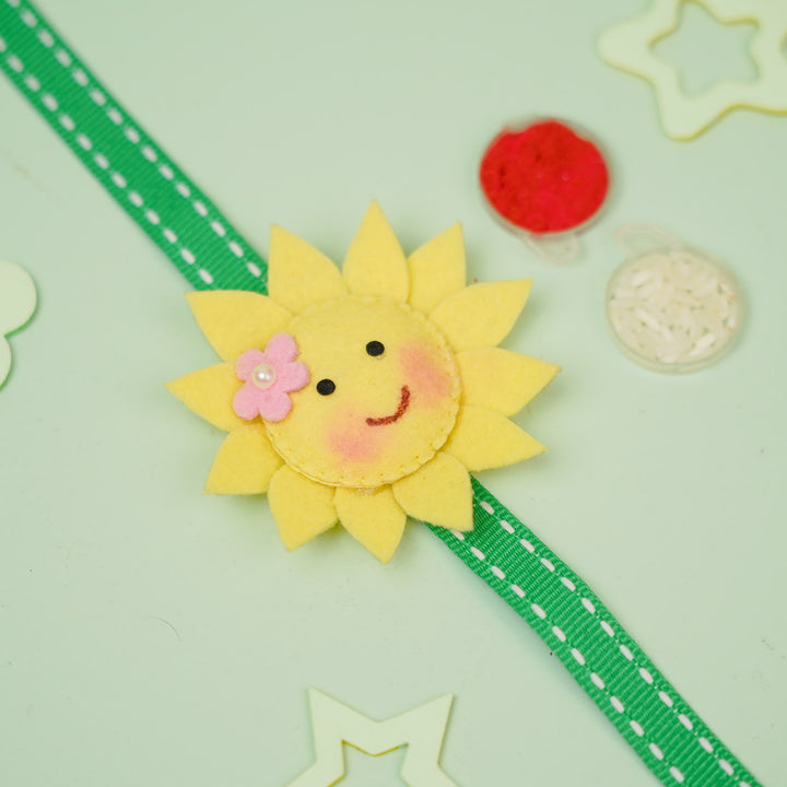 Handmade Sunflower Theme Felt Kids Rakhi With Roli Chawal - Flat Lay of Ribbon Accessory