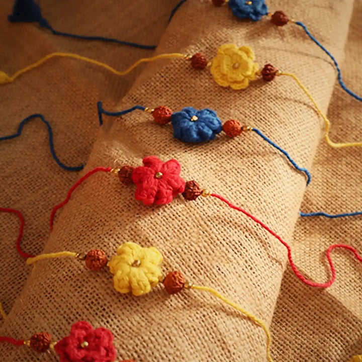 Handmade Crochet Flower And Rudraksh Rakhi With Roli Chawal Set Of 6 - Close-up on Bracelet Details
