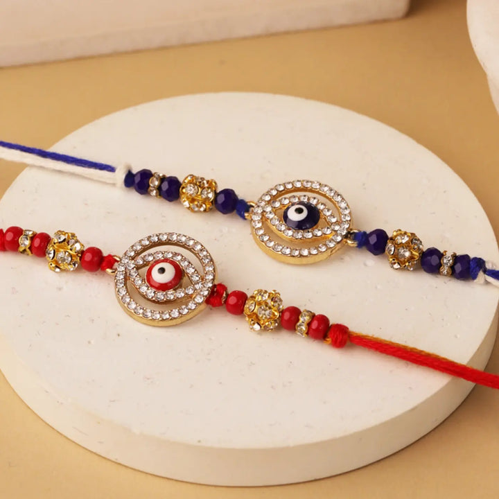 Handmade Red & Blue Evil Eye Rakhi With Roli Chawal | Set Of 2