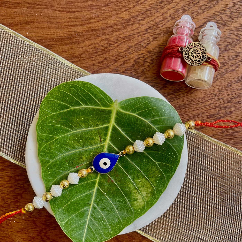 Handmade Evil Eye Design Metal Rakhi 10 - Top view with full bracelet display