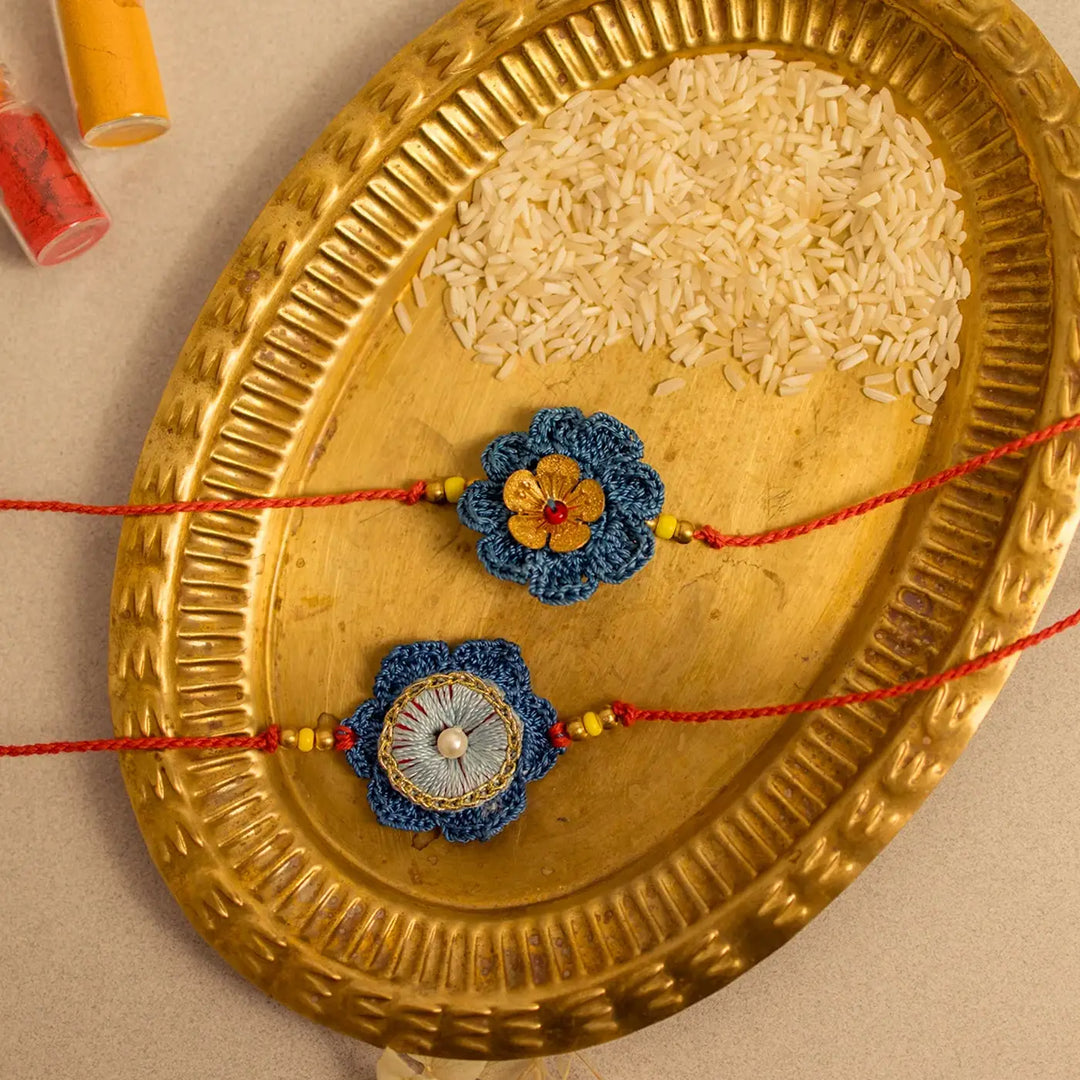 Handmade Crochet Neelam Flower Rakhi With Roli Chawal Set Of 2 - Close-up on Rakhi designs