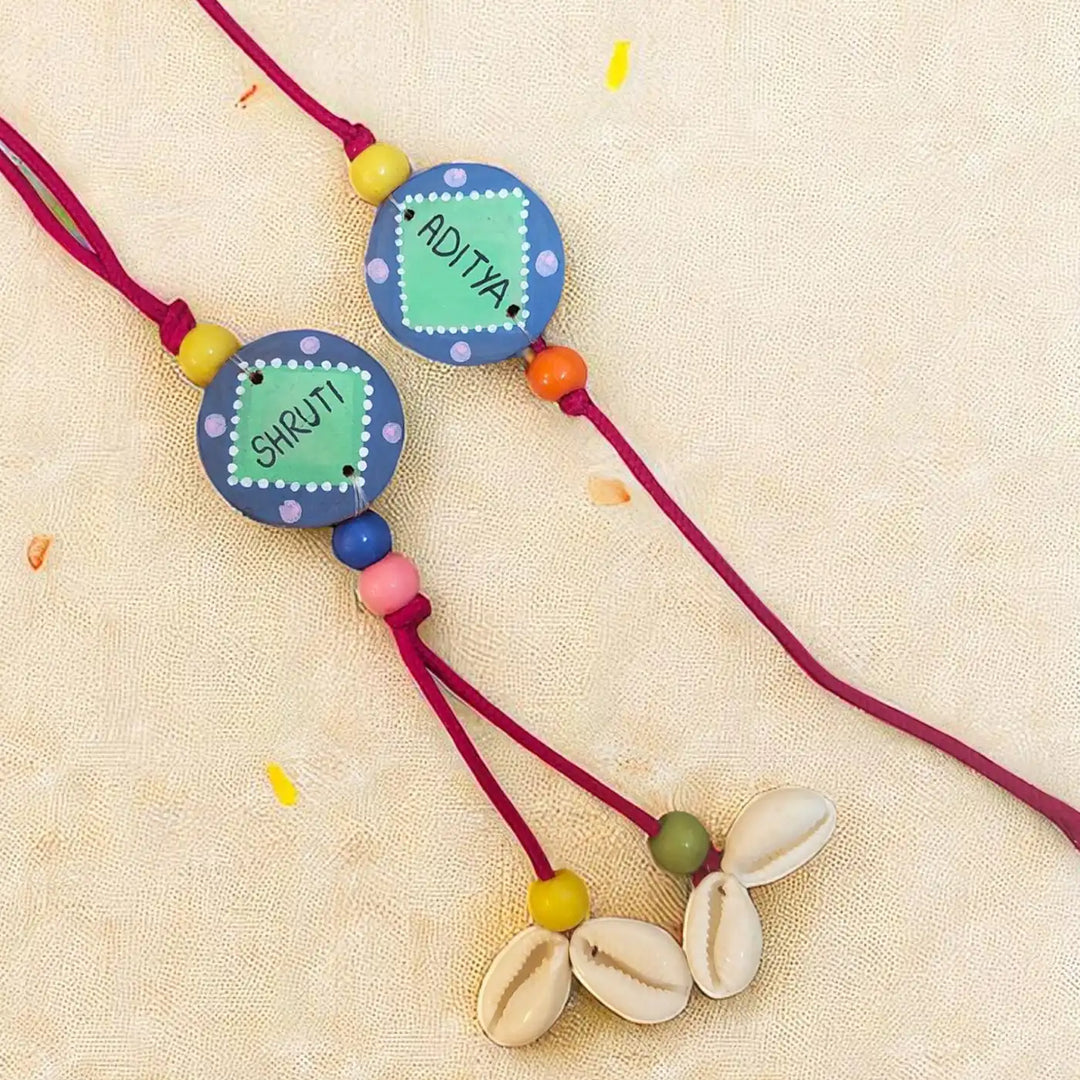 Personalized Round Blue & Green Shell Terracotta Bhaiya Bhabhi Rakhi | Set Of 2