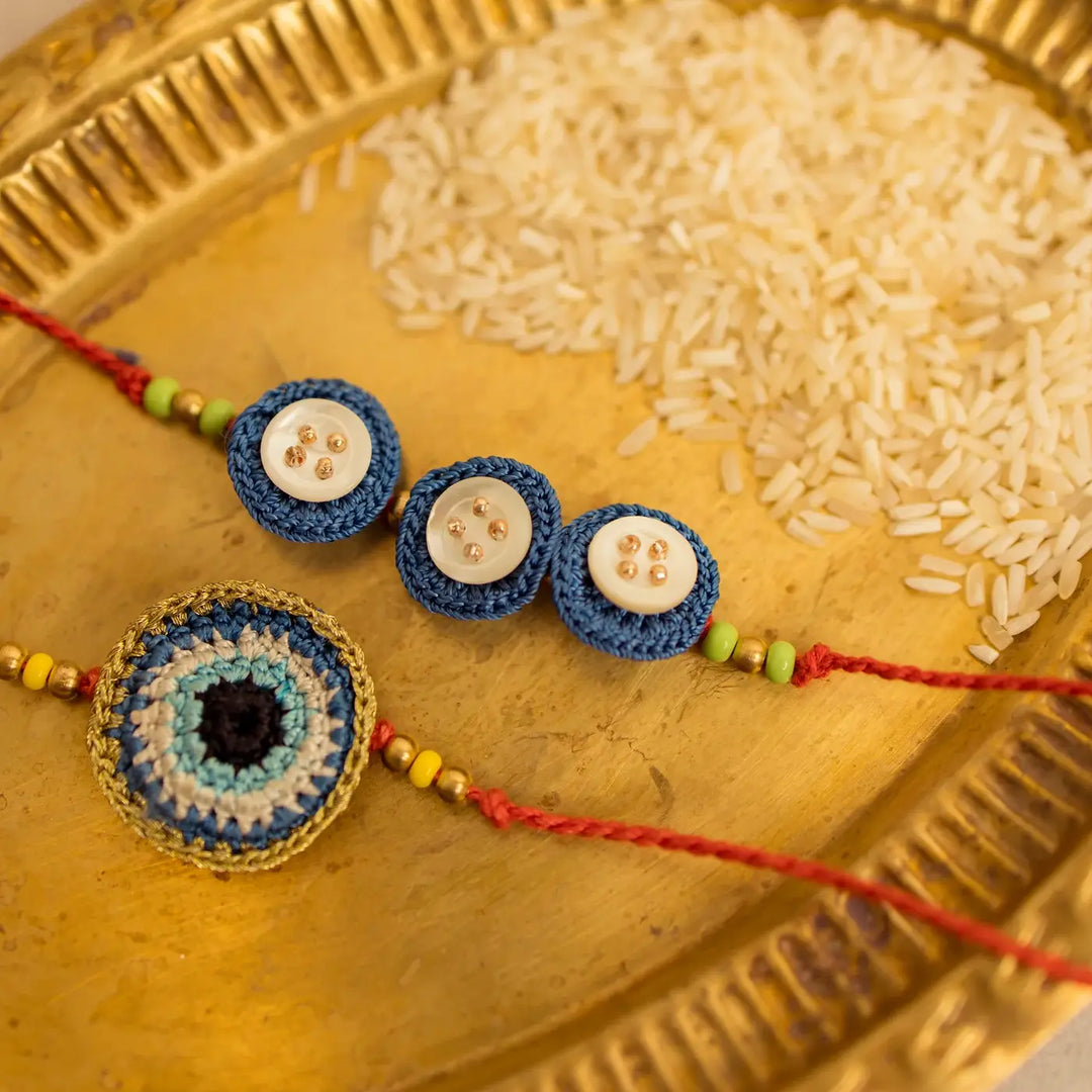 Handmade Crochet Noor And Nazar Evil Eye Rakhi With Roli Chawal Set Of 2 - Detailed view of bracelets