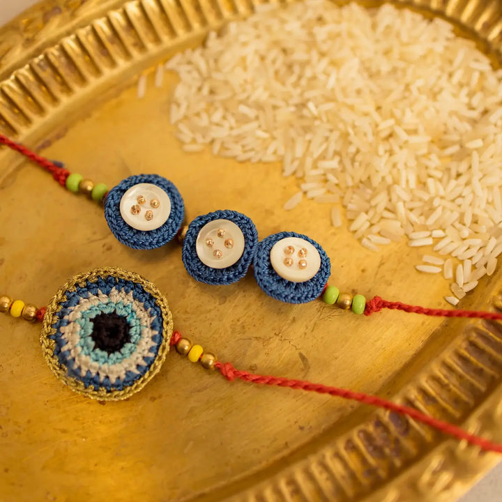 Handmade Crochet Noor And Nazar Evil Eye Rakhi With Roli Chawal Set Of 2 - Detailed view of bracelets