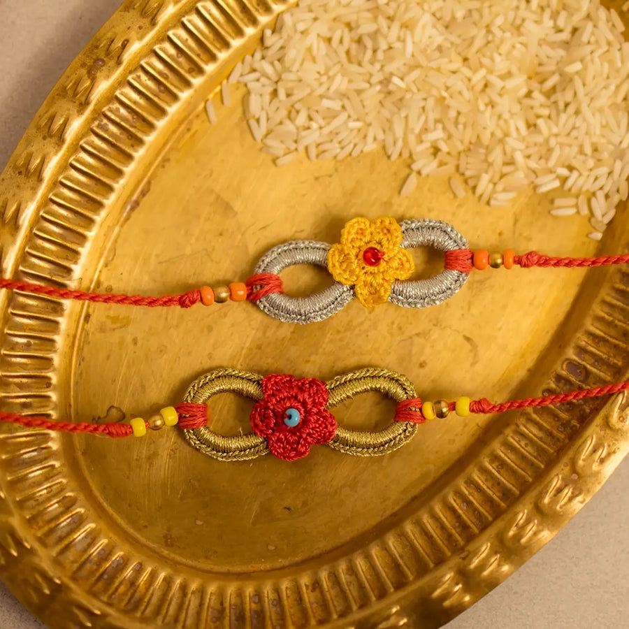 Handmade Crochet Ananta Rakhi With Roli Chawal Set Of 2 1 - Close-up of two bracelets