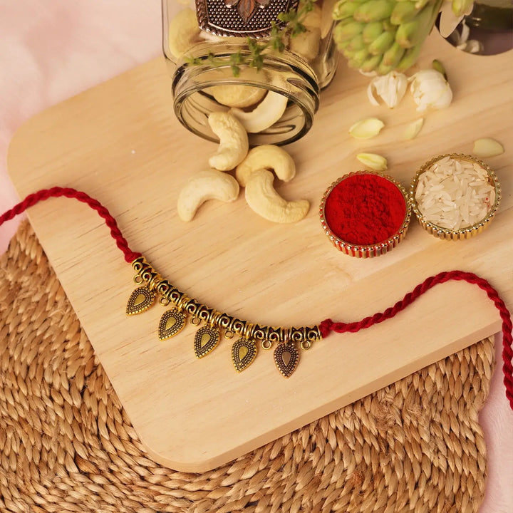 Handmade Golden Leaf Charm Rakhi With Roli Chawal