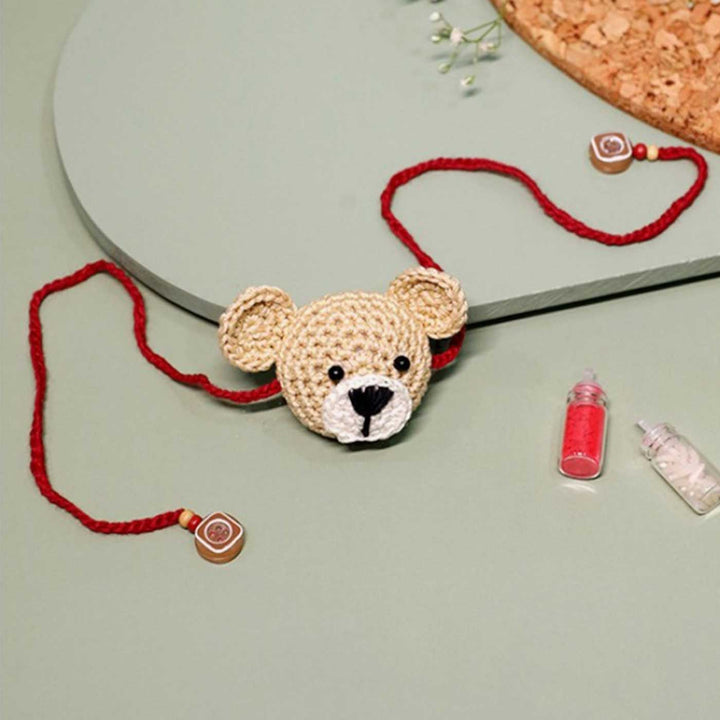 Handmade Crochet Teddy Hug Kids Lumba Rakhi With Roli Chawal - Front View with String Detail