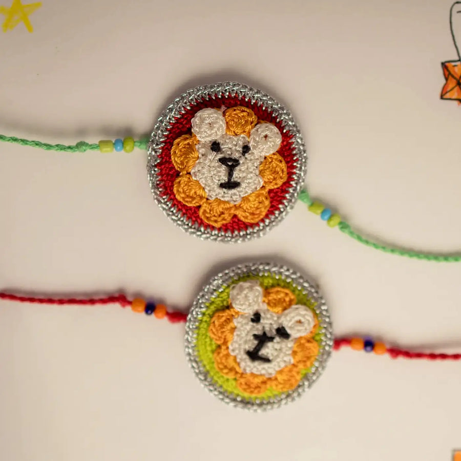 Handmade Crochet Lion Theme Kids Rakhi With Roli Chawal Set Of 2 - Close-up of Lion Bracelets