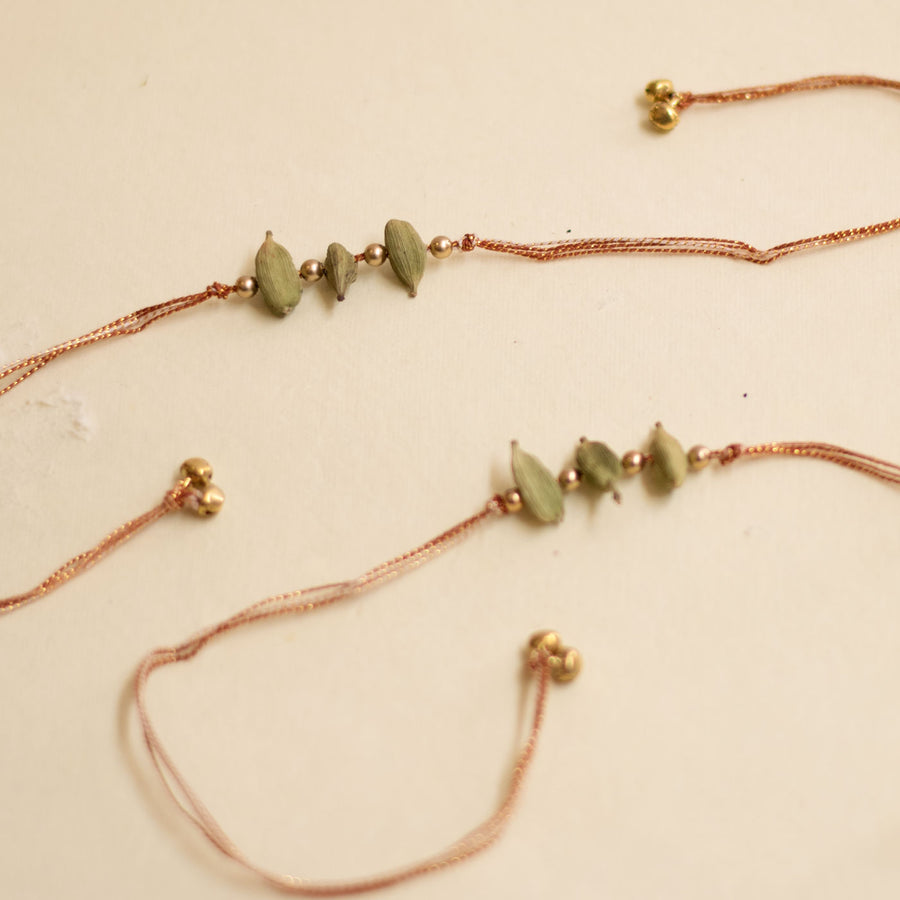 Handmade Sugandh Ilaichi And Pearl Rakhi With Roli Chawal - Full Item Layout