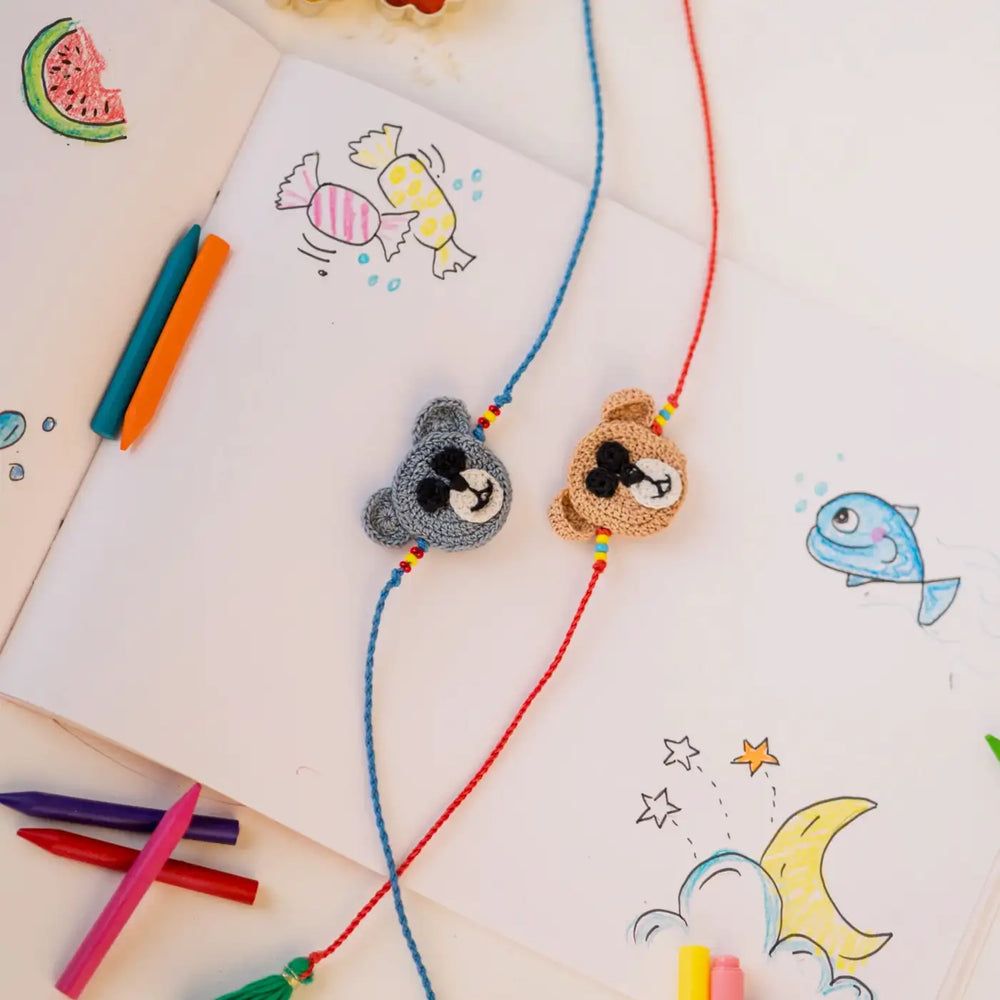 Handmade Crochet Grey And Brown Bear Theme Kids Rakhi With Roli Chawal Set Of 2 - Flat Lay with Drawing Details