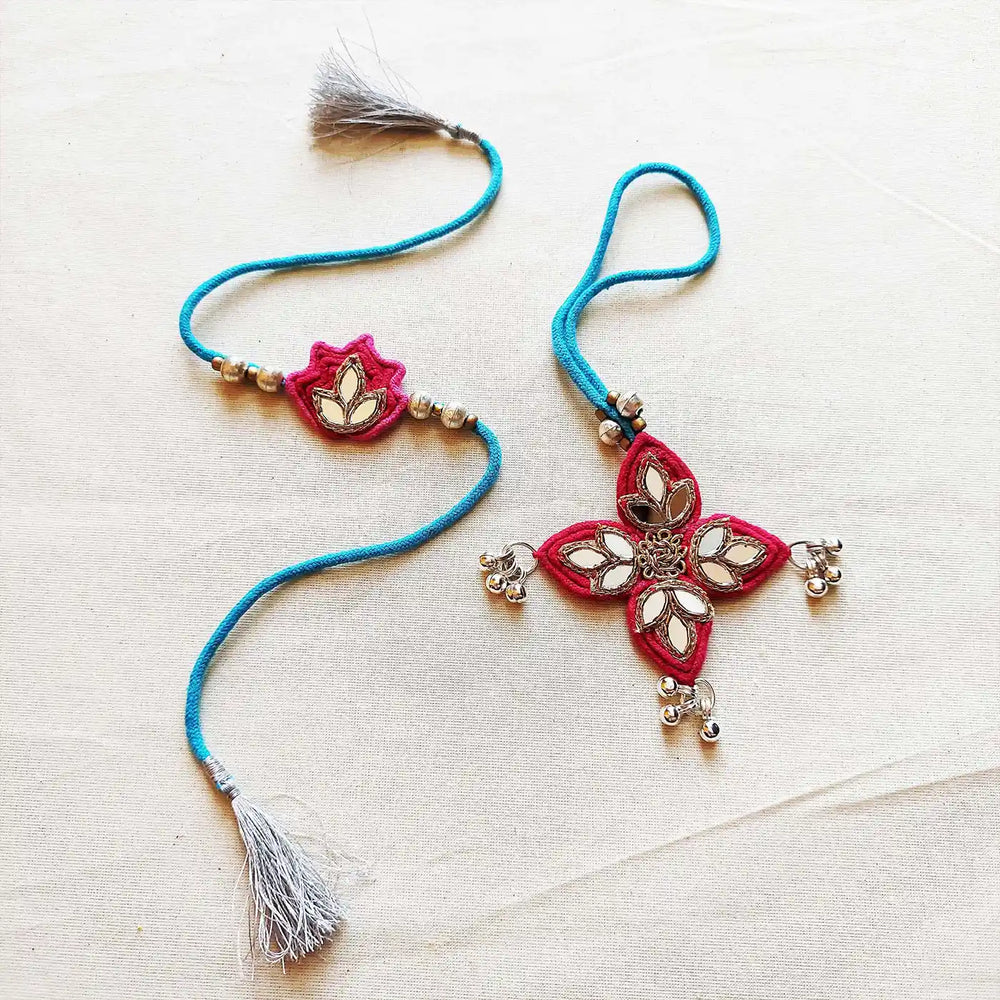 Handmade Mirror Work Lotus Bhaiya Bhabhi Rakhi With Roli Chawal Set Of 2 - Flat Lay View