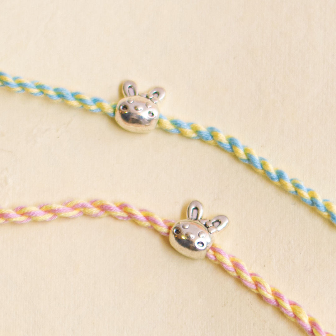 Handmade Silver Bunny Design Kids Rakhi With Roli Chawal - Close-up of charm on cord