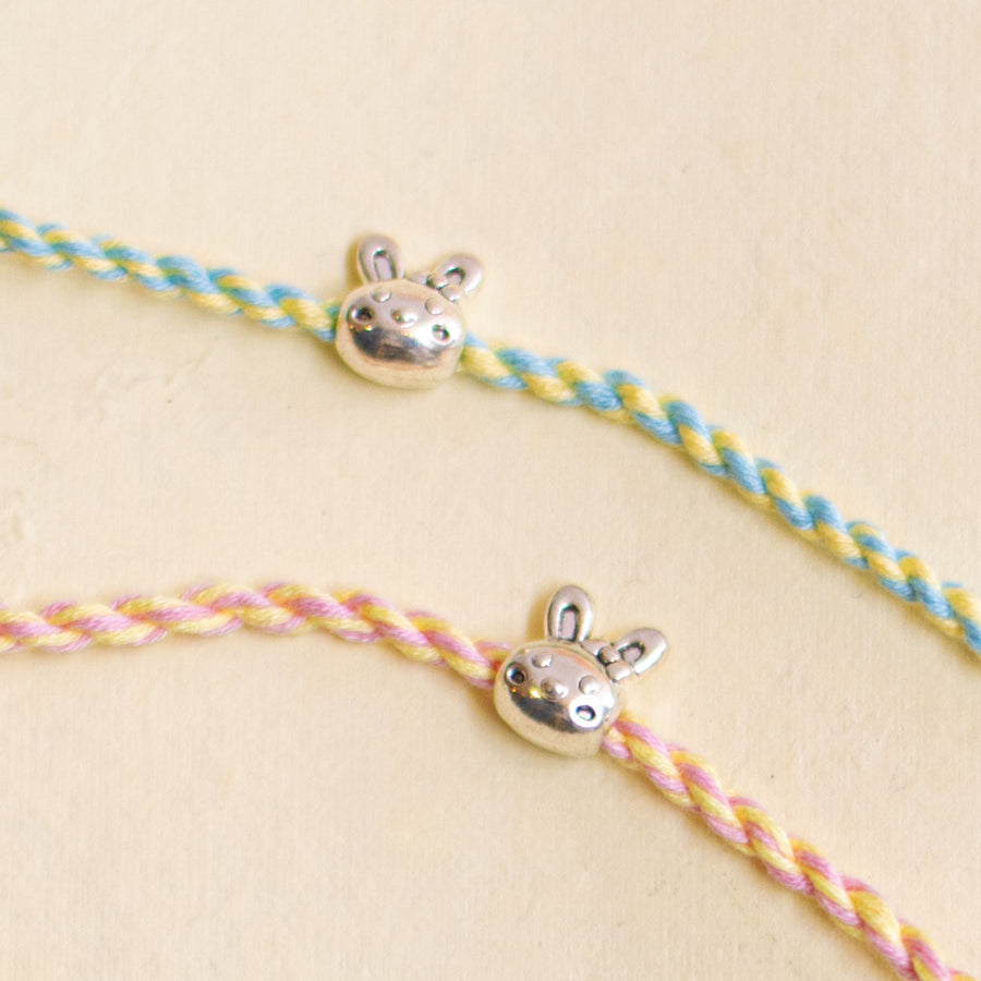 Handmade Silver Bunny Design Kids Rakhi With Roli Chawal - Close-up of charm on cord
