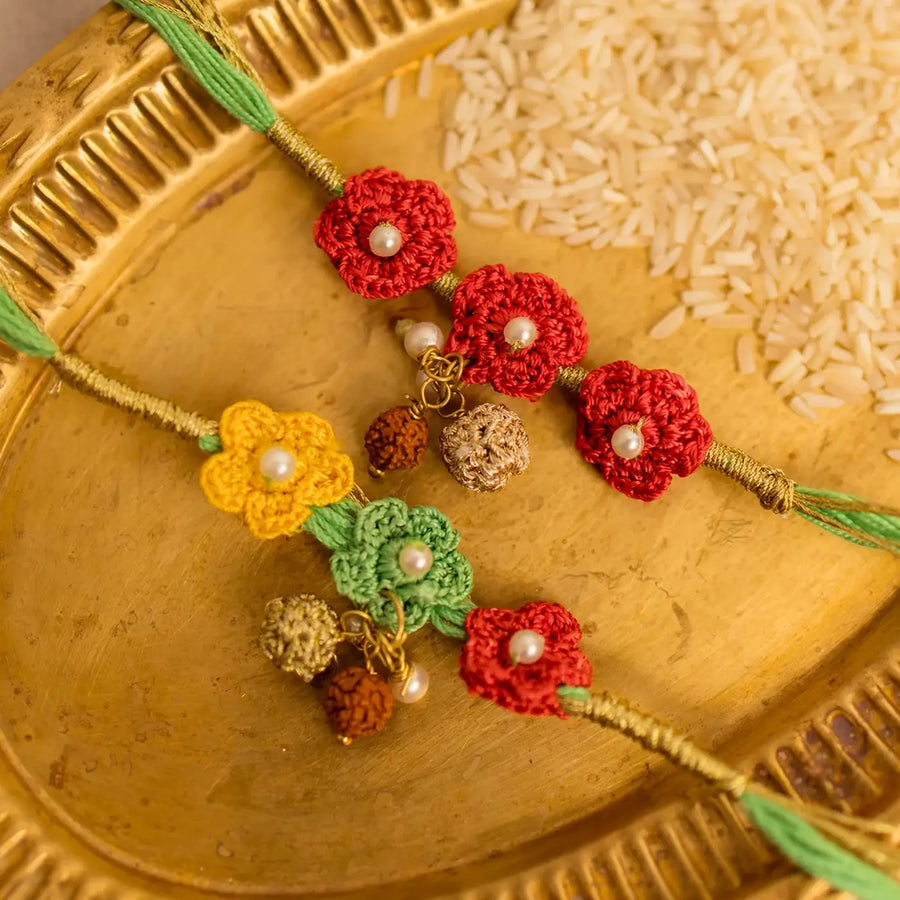 Handmade Crochet Ananya Phool And Rudraksh Rakhi With Roli Chawal Set Of 2 - Close-up of Floral Rakhi Threads
