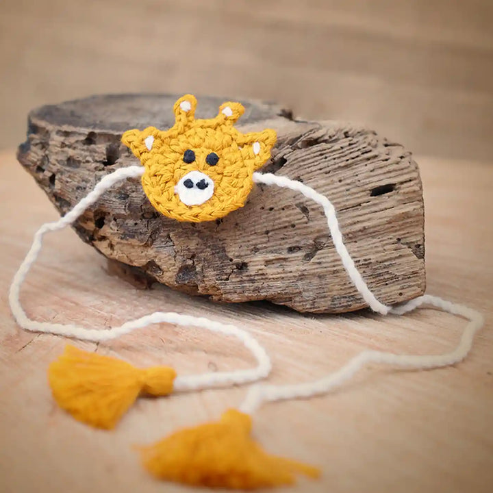 Handmade Crochet Giraffe Theme Kids Rakhi And Toy Combo With Roli Chawal Set Of 2 - Close-up on accessory detail