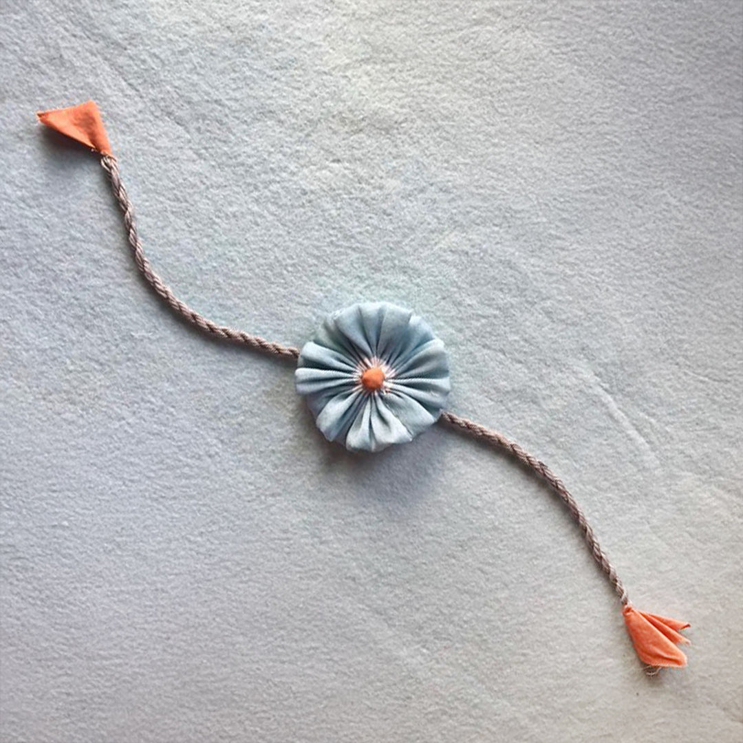 Handmade Beaded Daisy Flower Design Upcycled Fabric Rakhi With Roli Chawal For Brother - Single Floral Knot Band Front View