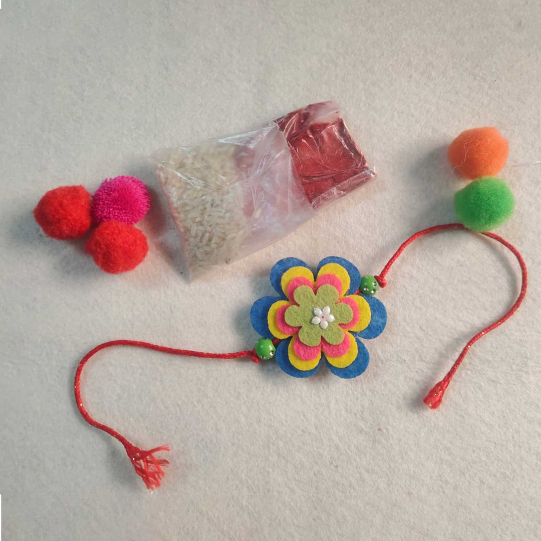Handmade Beaded Flower Theme Pom Pom Felt Rakhi With Roli Chawal For Kids - Full Set with Accessories