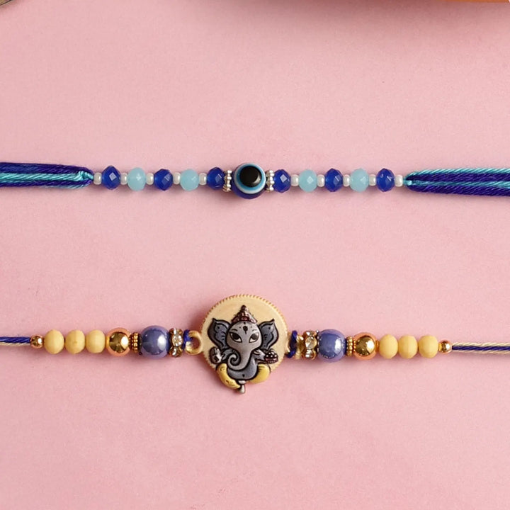 Handmade Ganesha & Evil Eye Kids Rakhi With Roli Chawal | Set Of 2