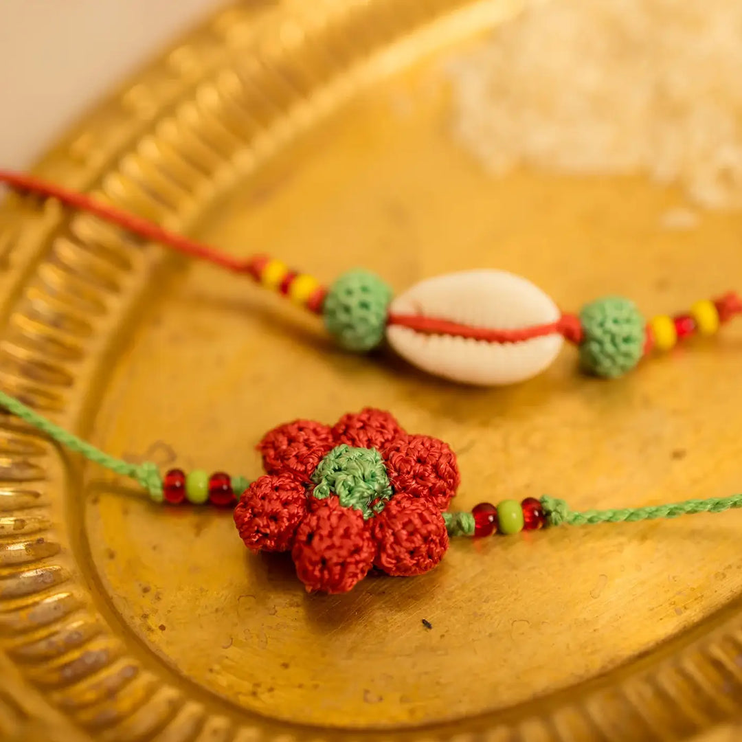 Handmade Crochet Phool Kaudi Rakhi With Roli Chawal Set Of 2 - Close-up showing handcrafted details