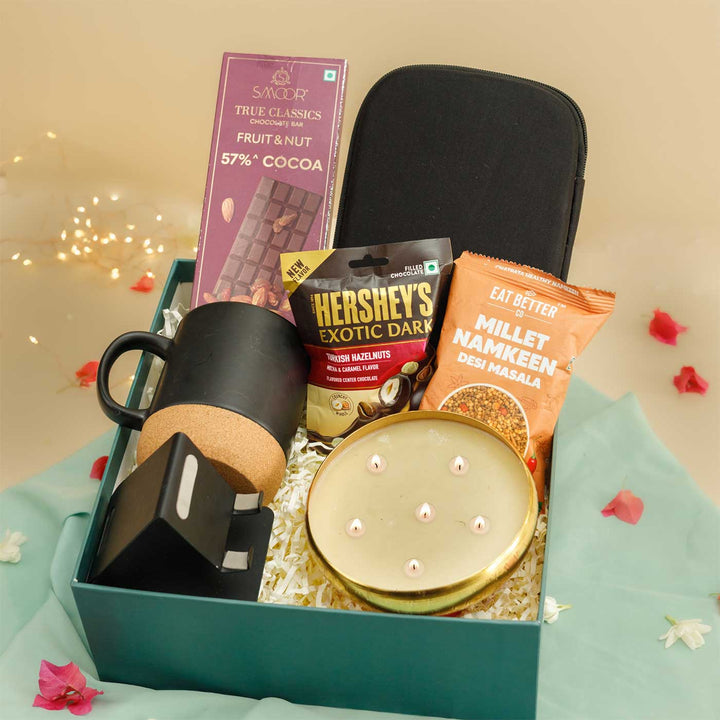 Handmade Neerja Gift Hamper | Includes 1 Mug, 1 Mobile Holder, 1 Pouch, 1 Candle, 1 Namkeen, 1 Chocolate, 1 Smoor Bar, 1 Card And 1 Box
