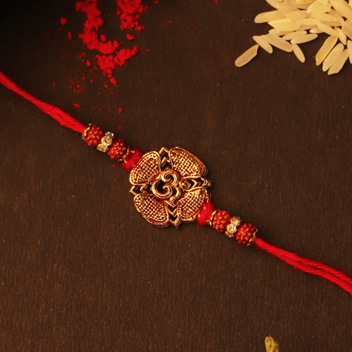 Handmade Golden Om Rakhi With Roli Chawal
