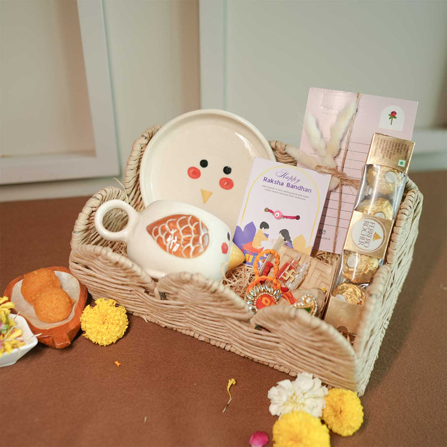 Personalized Handmade Foodie Theme Rakhi Hamper Includes 1 Basket 1 Plate 1 Mug 1 Rakhis 1 Roli Chawal 1 Chocolate And 1 Message Card - Wicker Basket Gift Set Display