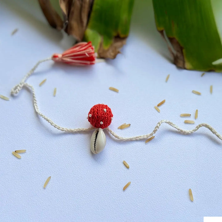 Handmade Crochet Cowrie Shell Rakhi With Roli Chawal