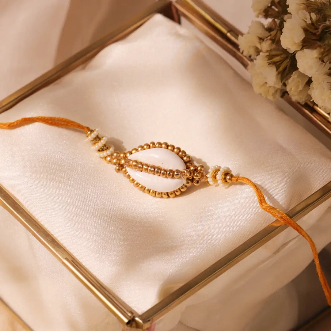 Handmade Beaded Golden Cowry Shell Rakhi With Roli Chawal