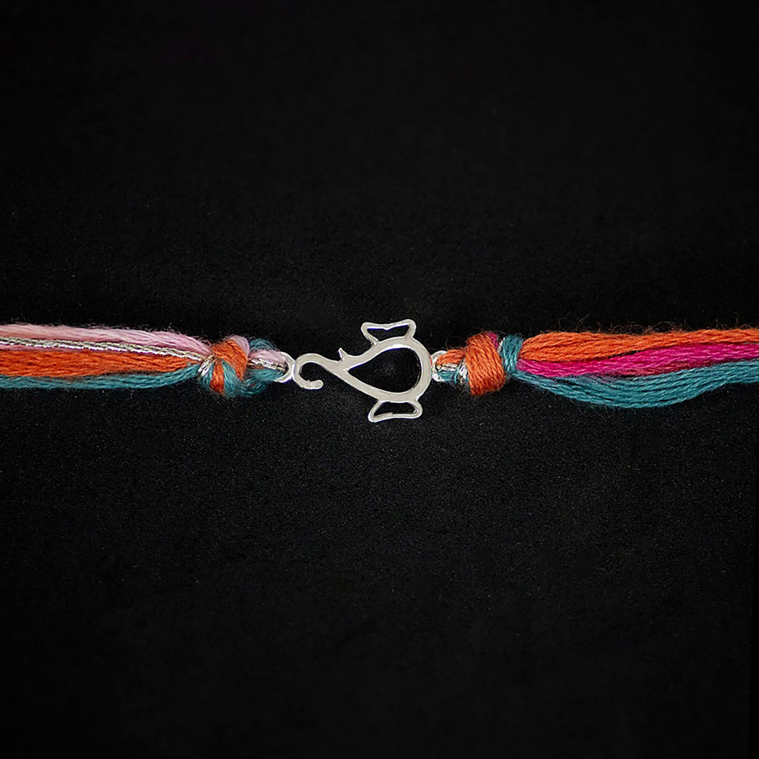 Handmade Ekdanta 925 Silver Rakhi With Roli Chawal For Brother - Close-up of Knot and Charm