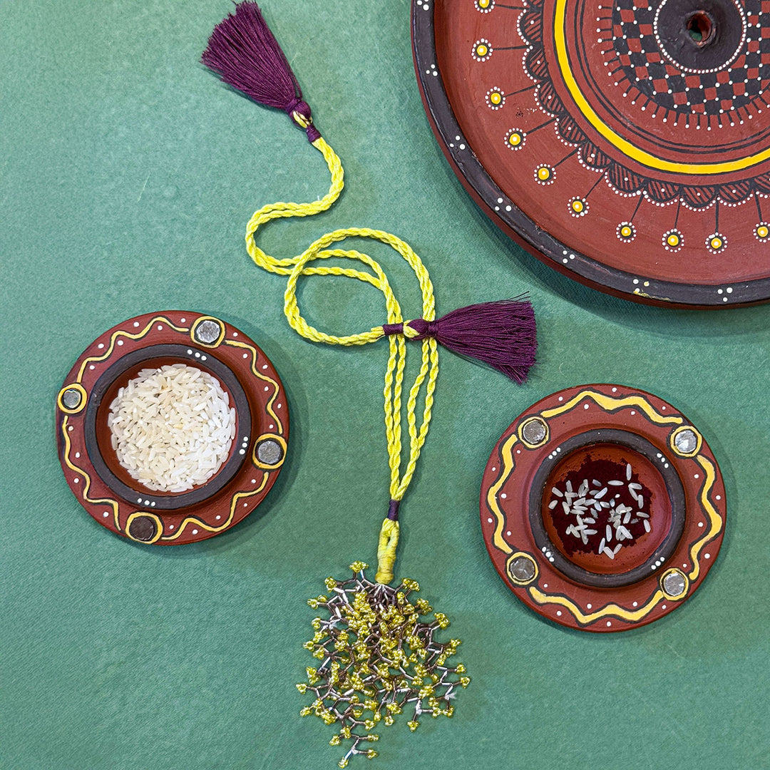 Handmade Reusable Yellow Corel And Jhumki Rakhi For Bhabhi - Top View with Accessories