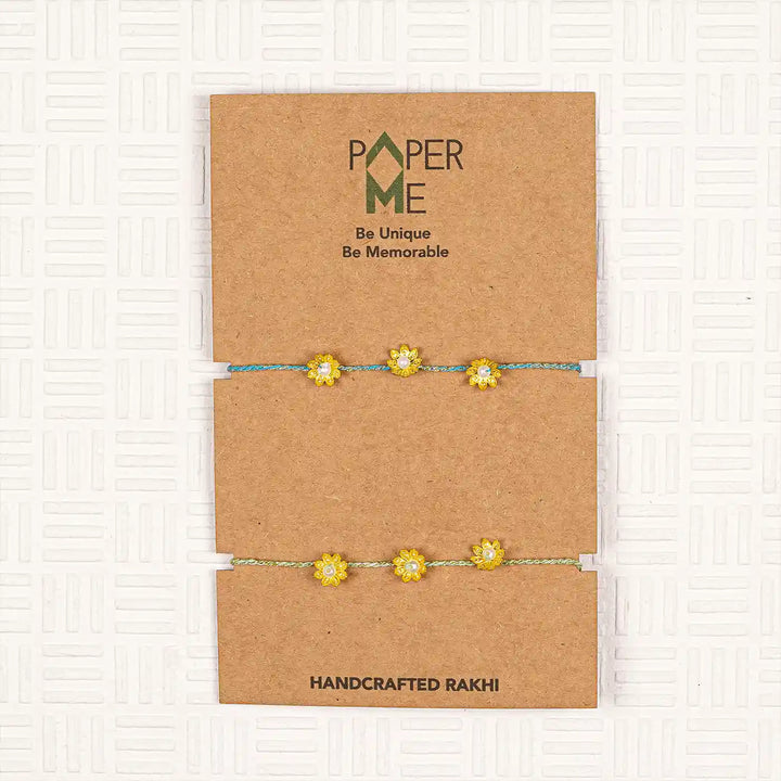 Handmade Golden Flower Rakhi With Roli Chawal Set Of 2 - Packaging Display View