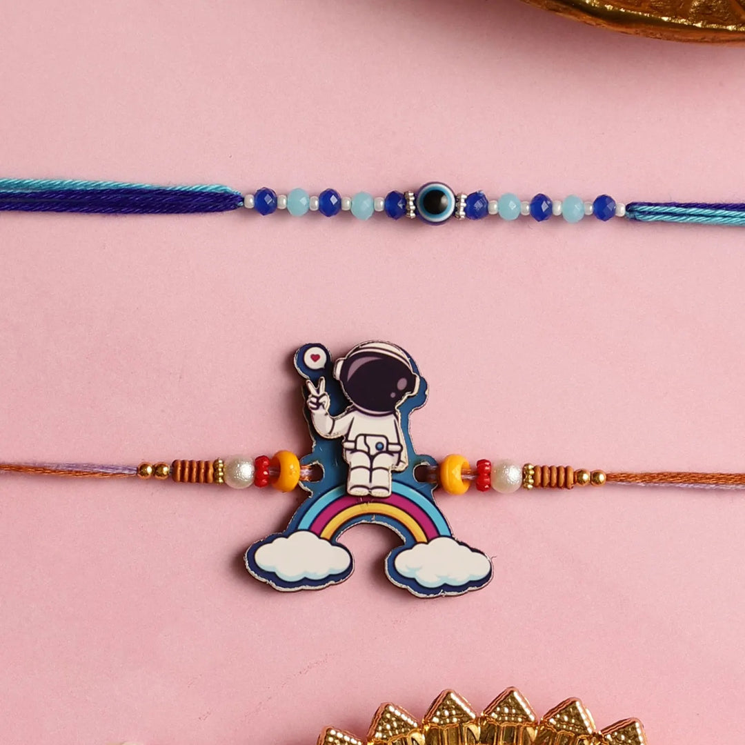 Handmade Beaded Astronaut & Evil Eye Kids Rakhi With Roli Chawal | Set Of 2