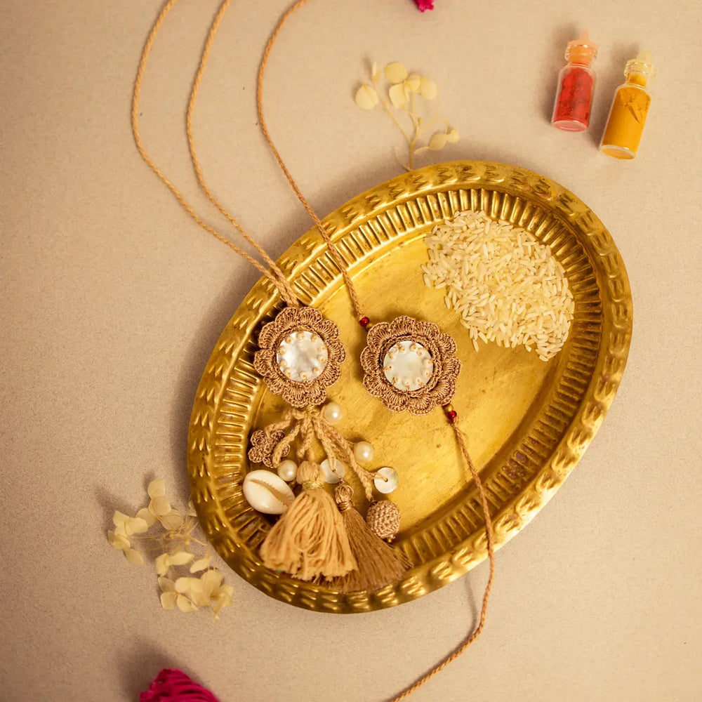 Handmade Crochet Golden Seepi Bhaiya Bhabhi Rakhi With Roli Chawal Set Of 2 - Decorative Set Display on Golden Tray