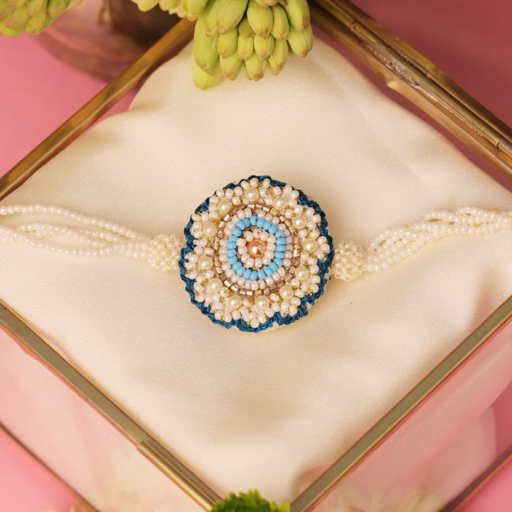 Handmade Beaded White & Blue Floral Rakhi With Roli Chawal