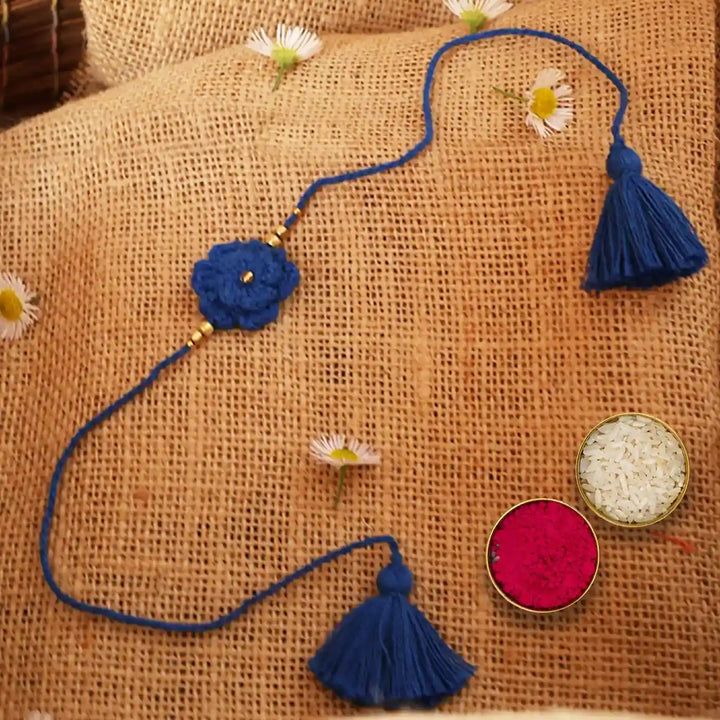 Handmade Crochet Blue Flower Rakhi With Roli Chawal - Blue Threaded Flower on Burlap