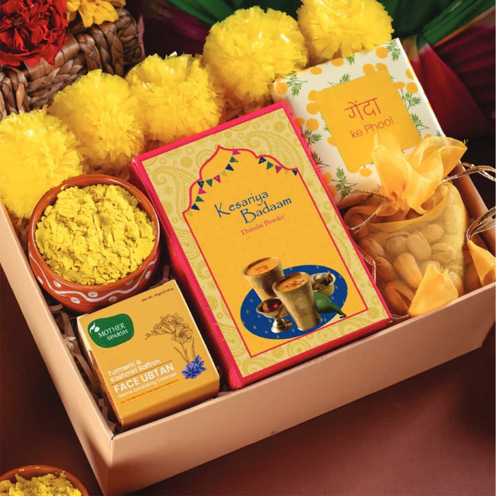 Holi Bliss in Yellow Gift Hamper | Includes 5 Faux Genda Flowers, 1 Yellow Gulaal, 1 Thandai, 1 Mix Dry Fruit Nuts, 1 Uptan Face Mask, 1 Kulhad, 1 Marigold Seeds Pack, 1 Classic Gift Box