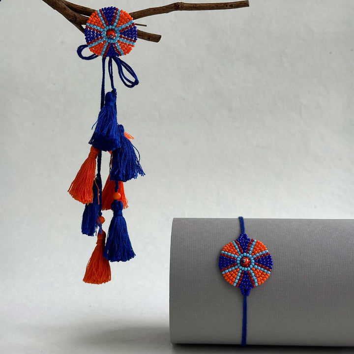 Customized Handmade Beaded Chakri Design Lumba Rakhi For Bhabhi With Roli Chawal - Hanging with Tassels and Rolled Display
