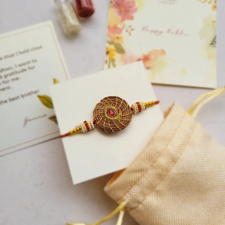 Eco Friendly Handmade Red Stone Pine Needle Rakhi With Pouch And Roli Chawal - Packaging with Gift Card