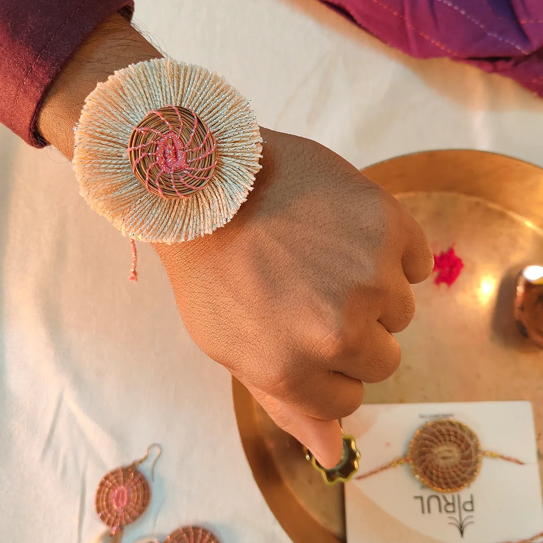 Eco Friendly Handmade White And Pink Pine Needle Rakhi With Pouch And Roli Chawal - Worn on Wrist