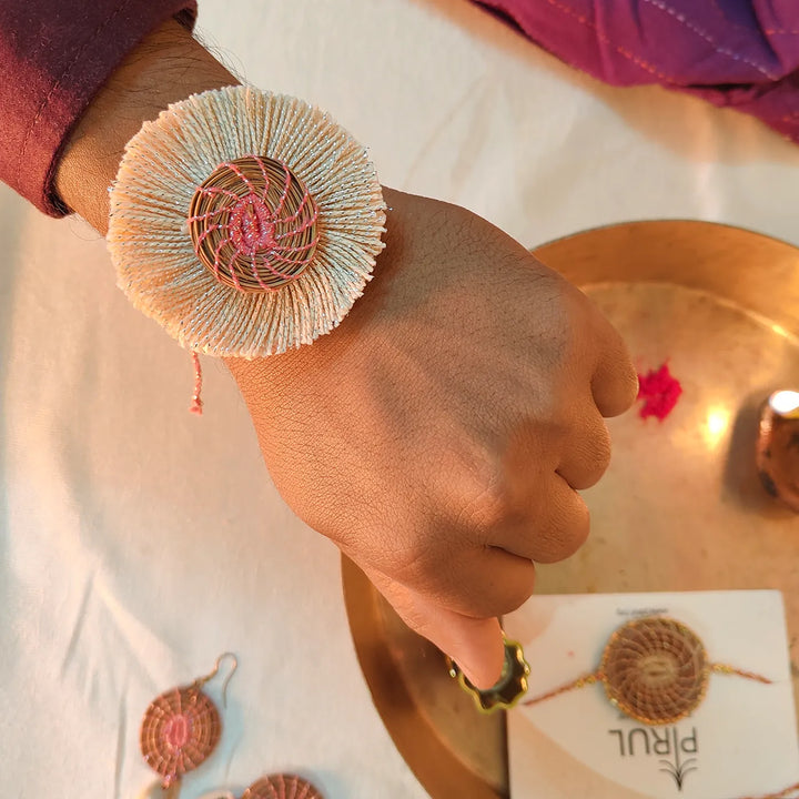 Eco Friendly Handmade White And Pink Pine Needle Rakhi With Pouch And Roli Chawal - Worn on Wrist