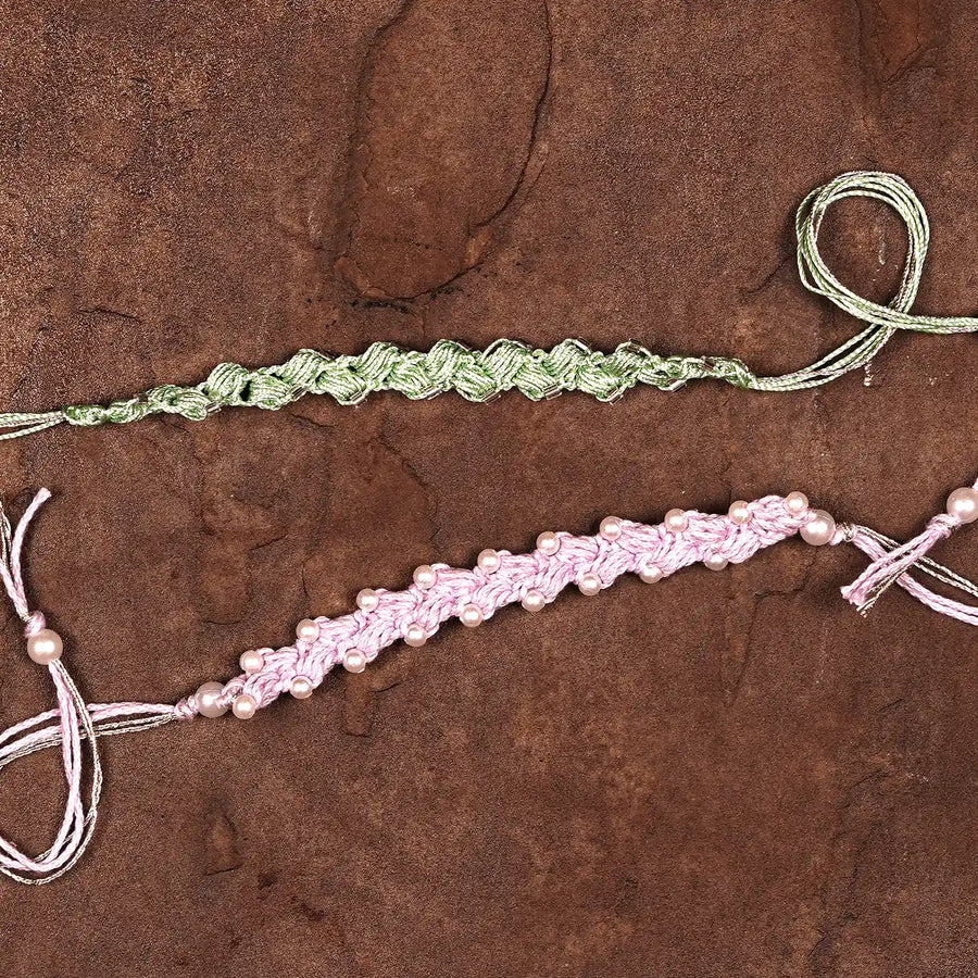 Handmade Crochet Beaded Rakhi With Roli Chawal Set Of 2 - Two Bracelets Laid Flat