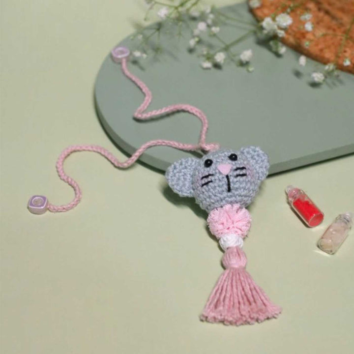 Handmade Crochet Kitty Kisses Kids Rakhi With Roli Chawal - Front View with Decor Items