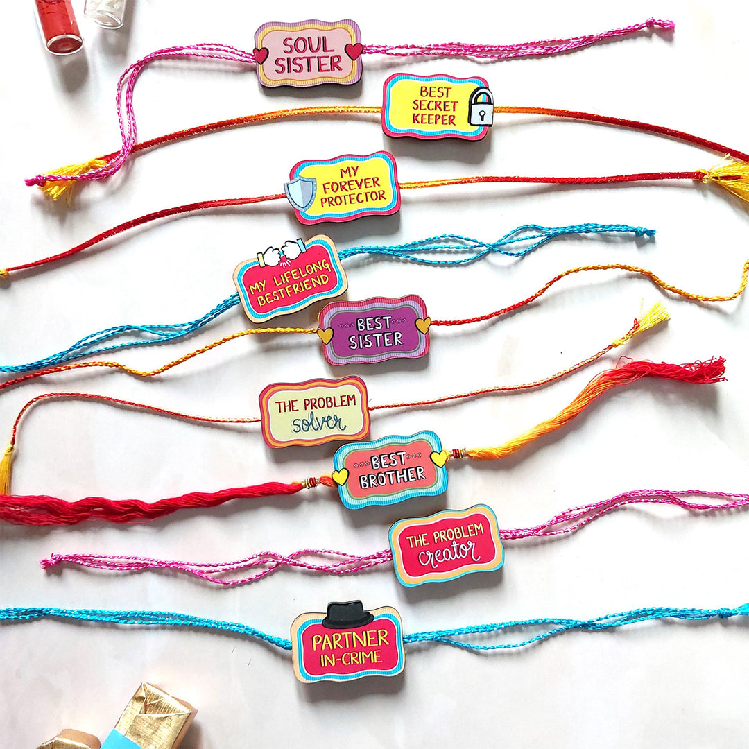 Glossy Printed Wooden Assorted Rakhi Combo With Kumkum Rice | Set of 9