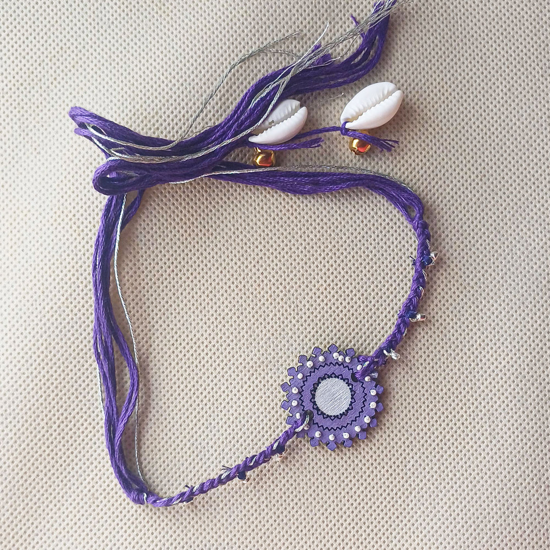 Handmade Puprle Ghungroo Shell And Beads Wooden Bhaiya Bhabhi Rakhi With Roli Chawal - Full Necklace Laid Flat